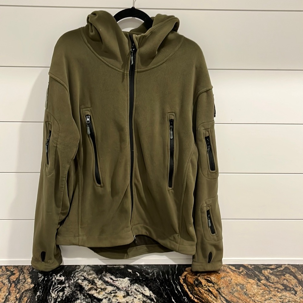 Tactical Series Fleece Jacket with hood. Zipper pockets and Velcro for patches.